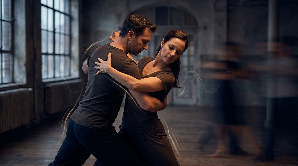 Two dancers moving together in a cinematic scene with subtle visual rhythm and timing motifs